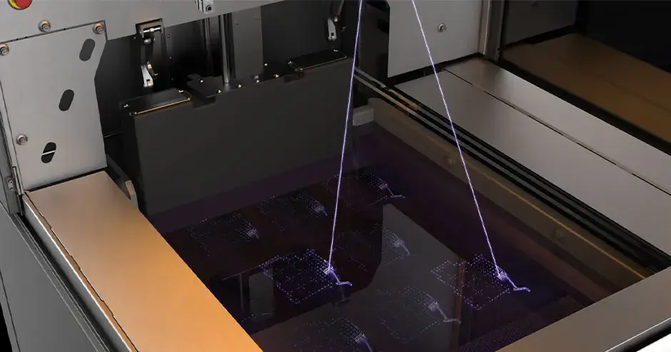 Intérieur de l'imprimante 3D SLA 750 montrant sa technologie de numérisation laser
