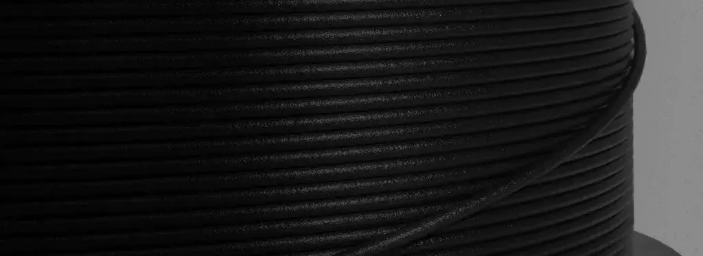 a roll of black filament