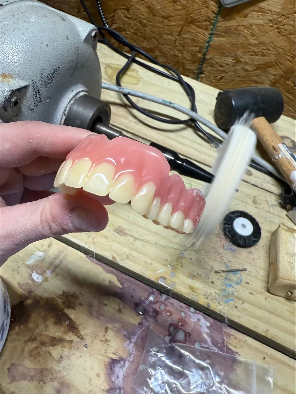 3D printed Jetted Dentures are finished with a quick polish after wax supports are removed.